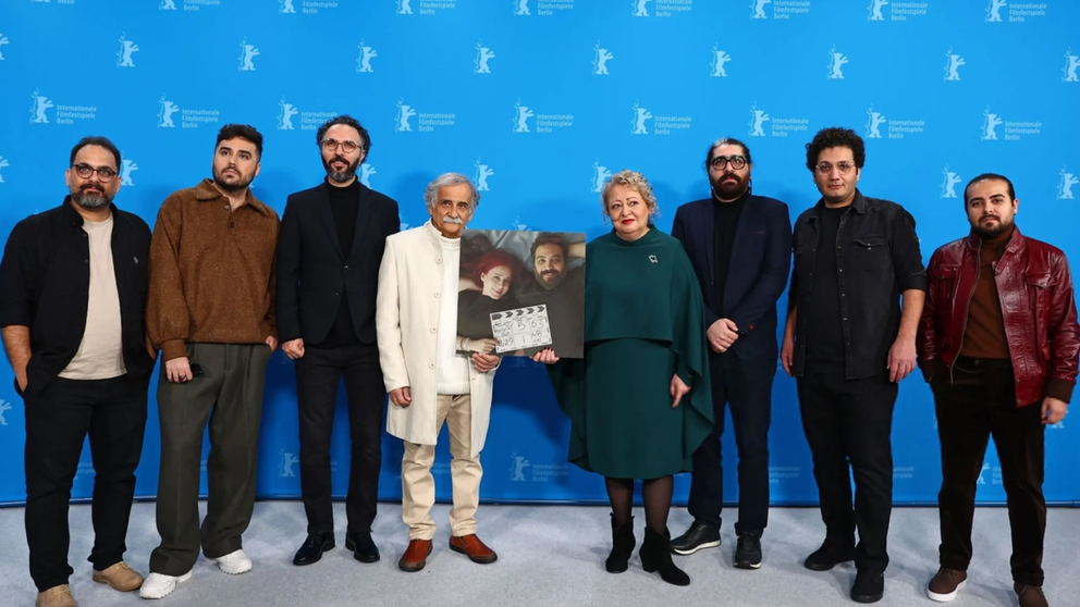 Etienne de Ricaud (4th from left), Lily Farhadpour (4th from right), and the film team hold a photo of Maryam Moghaddam and Behtash Sanaeeha at the My Beloved Cake photocall during the 74th Berlinale International Film Festival Berlin at the Grand Hyatt Hotel on February 16, 2024, in Berlin, Germany. 