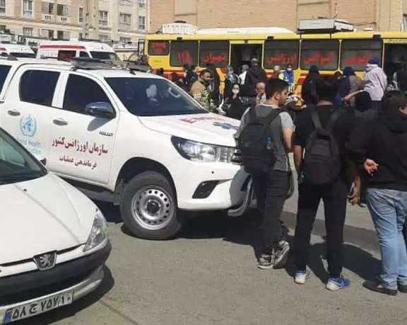 People gathered at the scene of one of the chemical attacks on schoolgirls in the capital Tehran.