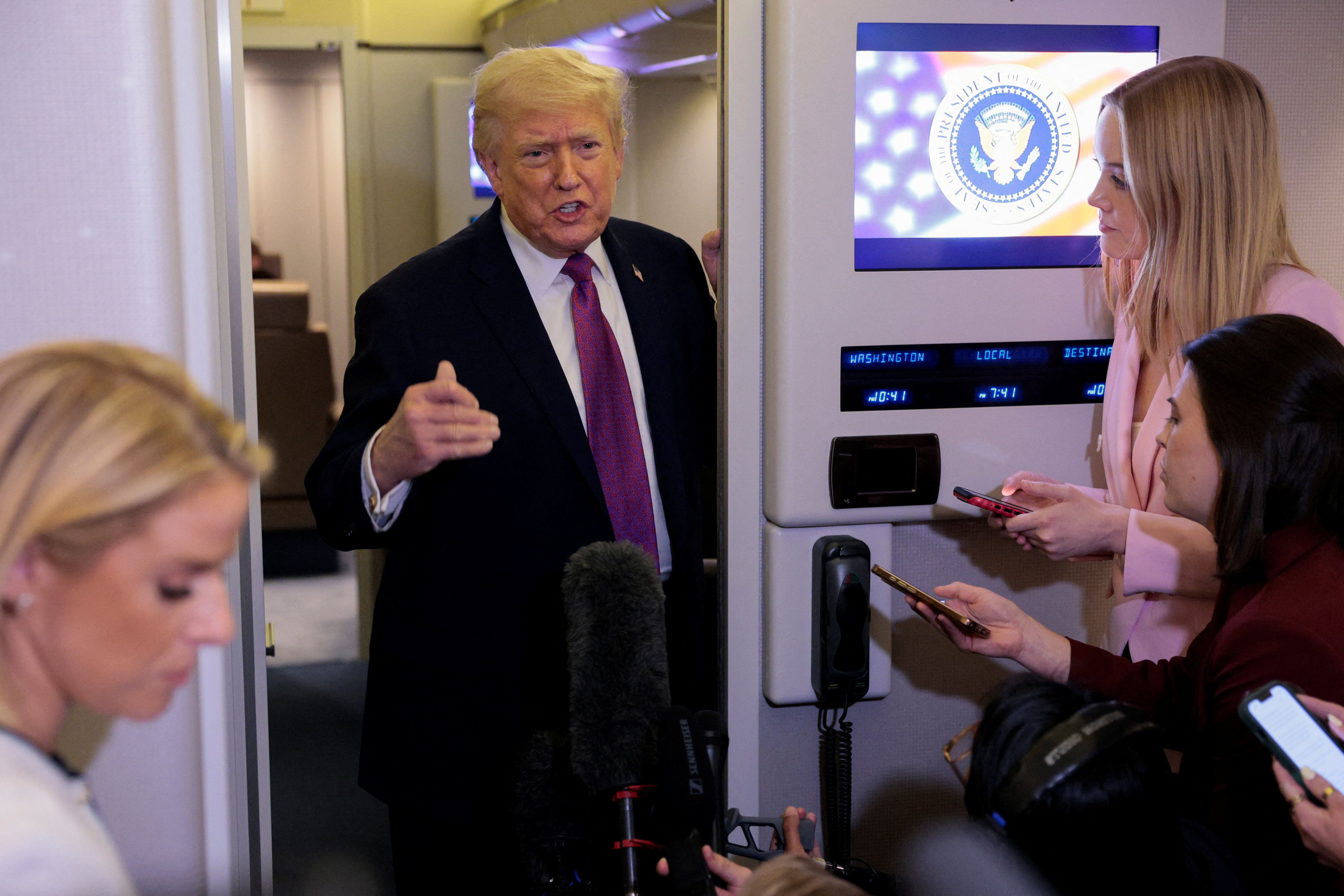 US President Donald Trump talks to members of the media aboard Air Force One en route to Joint Base Andrews, Maryland, on April 17, 2026.