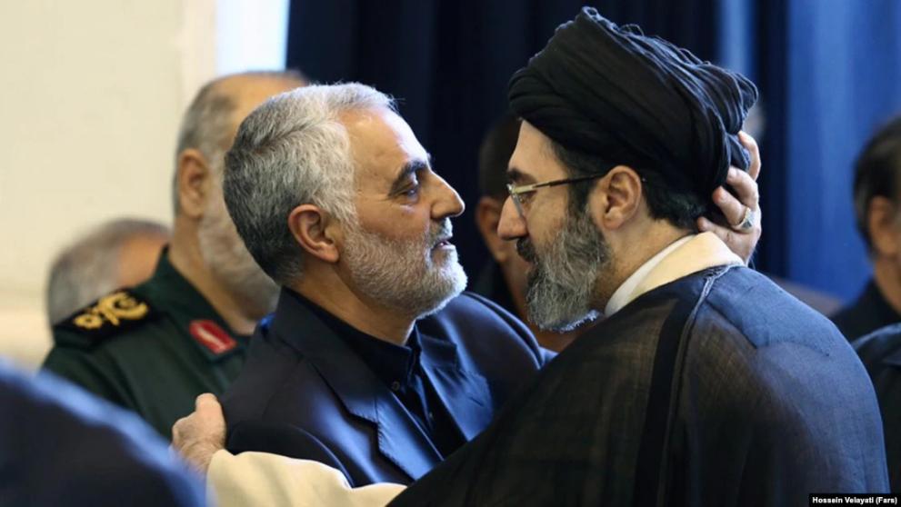 Mojtaba Khamenei (right) seen greeting former Qods Force commander Qasem Soleimani