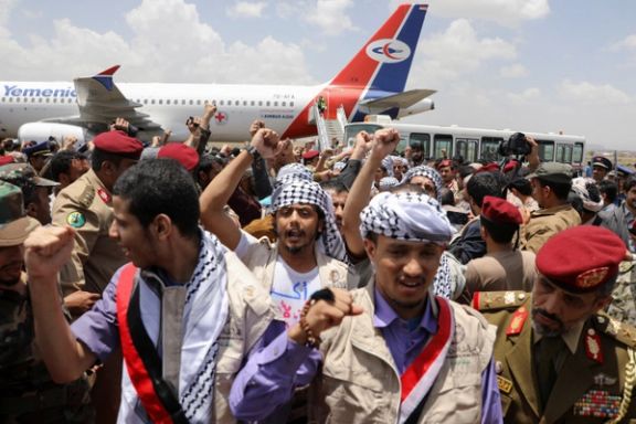 Freed prisoners walk after arriving at Sanaa Airport on an International Committee of the Red Cross (ICRC)-chartered plane, amid a prisoner swap between two sides in the Yemen conflict, in Sanaa, Yemen April 14, 2023.