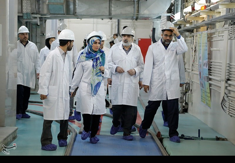 Deputy head of Iran's Atomic Energy Organization Behrouz Kamalvandi (second from right) visits an Iranian nuclear facility