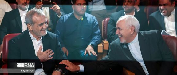 Iran's President-elect Masoud Pezeshkian (left) and former foreign minister Mohammad Javad Zarif during an event in Tehran