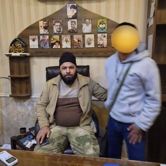 A photo circulating on social media purportedly showing Syrian opposition forces inside Iran's consulate in Aleppo.
