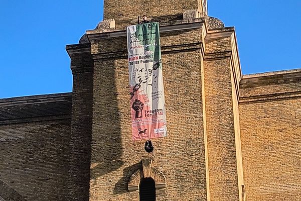 Protester climbs London’s King’s Cross tower with freedom banner for Iran