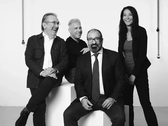 A photo showing Austrian-Iranian lawyer Ramin Mirfakhraei (sitting in front), whose connections with Blue River have raised concerns over visa facilitation for senior Iranian officials and sanctions evasion