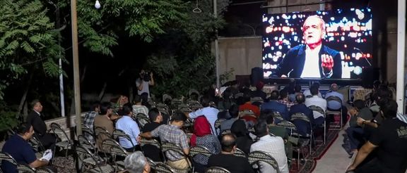 A group of Iranians watching the first presidential debate on June 17, 2024