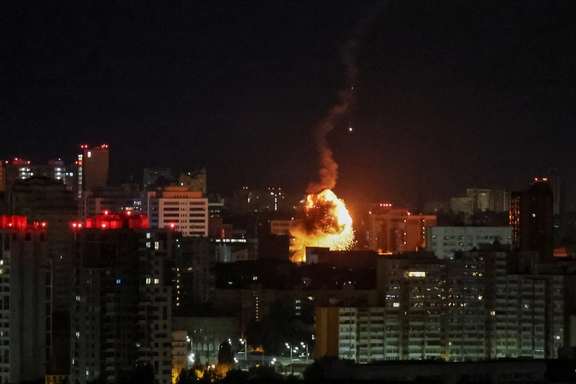 An explosion of a drone is seen in the city during a Russian drone strike in Kyiv, September 10, 2023.