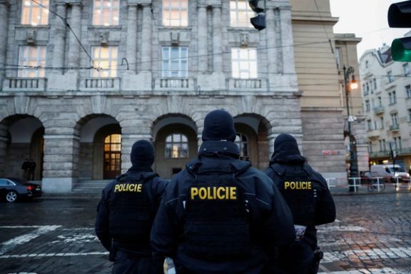 Members of the Police stand guard following a shooting at one of Charles University's buildings in Prague, Czech Republic, December 22, 2023.