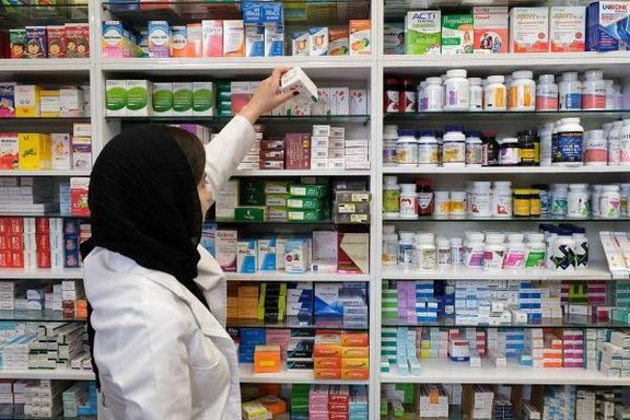A female pharmacy worker with hijab in Tehran
