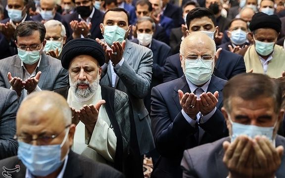 Ebrahim Raisi seen praying in a session of parliament on April 18, 2022