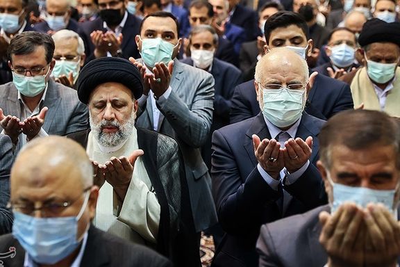 Ebrahim Raisi seen praying in a session of parliament on April 18, 2022
