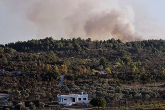 Smoke rises after Israeli shelling , as seen from Lebanese side, near the border with Israel, in Alma Al-Shaab, southern Lebanon, October 13, 2023.
