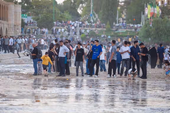 Residents gather along the Zayandeh Roud in Isfahan to celebrate the return of water to the river, June 3, 2026
