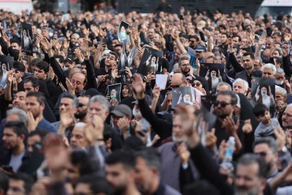 People gather to mourn for the death of the late Iran's President Ebrahim Raisi, in Tehran, Iran May 20, 2024.