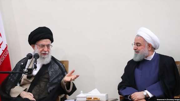An older photo of a meeting between Khamenei and Rouhani.