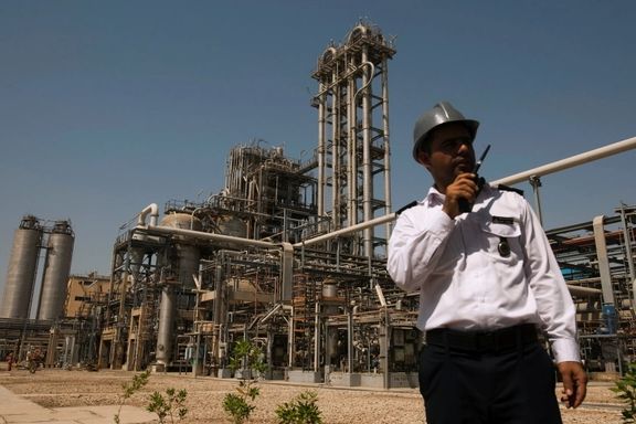 A security person stands in front of the Mahshahr petrochemical plant in Khuzestan province, Iran.
