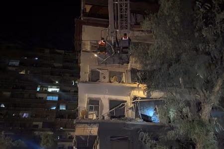 Rescuers work at the site of an Israeli airstrike that targeted a residential building in the Mezzah suburb, west of the Syrian capital Damascus, Syria's state news agency reported, Syria October 8, 2024.