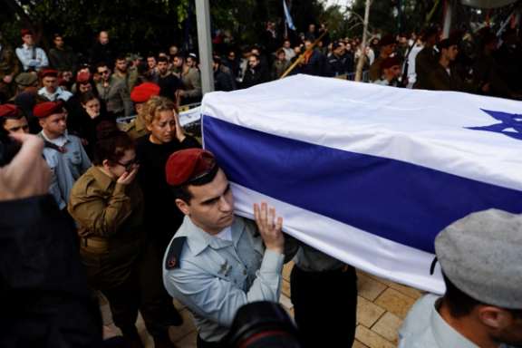 Israeli soldiers carry the casket, as friends and family mourn Israeli soldier Sergeant Major Ilay Levy, 24, who was killed in the Gaza Strip at his funeral in Tel Aviv, Israel, January 23, 2024.