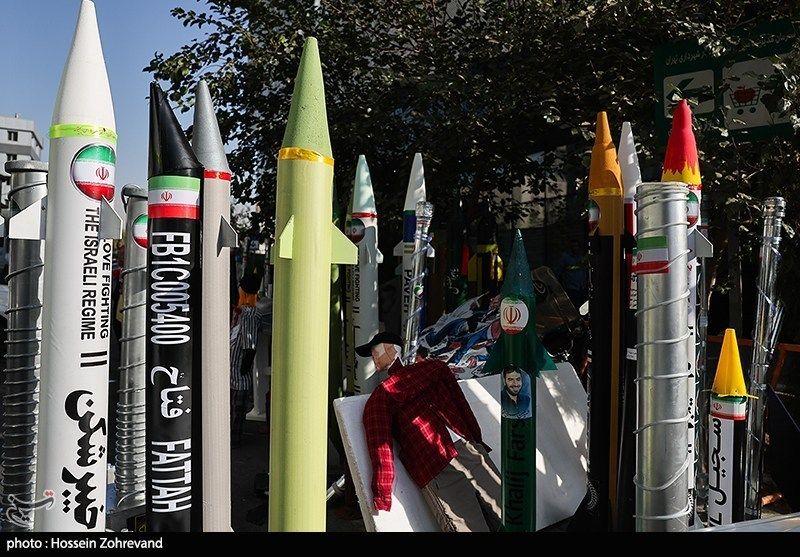 Models of Iranian ballistic missiles and nuclear centrifuges are displayed near the site of the former US embassy in Tehran during rallies marking the anniversary of the 1979 embassy takeover. (November 4, 2025) 