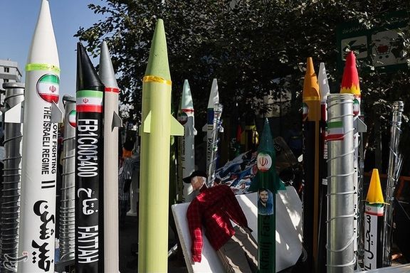 Models of Iranian ballistic missiles and nuclear centrifuges are displayed near the site of the former US embassy in Tehran during rallies marking the anniversary of the 1979 embassy takeover. (November 4, 2025)