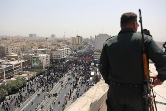People attend the funeral procession of Iranian military commanders, nuclear scientists and others killed in Israeli strikes, in Tehran, Iran, June 28, 2025.