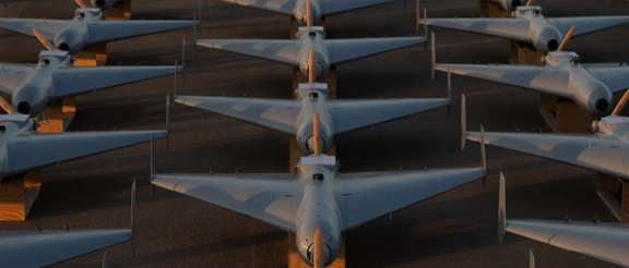 A row of US LUCAS one-way attack drones are shown in an image released by CENTCOM on December 3, 2025.