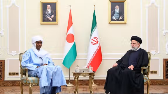 Niger's PM Ali Lamine Zeine (L) and Iranian President Ebrahim Raisi meet in Tehran on January 25, 2024.