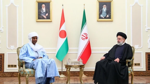 Niger's PM Ali Lamine Zeine (L) and Iranian President Ebrahim Raisi meet in Tehran on January 25, 2024.