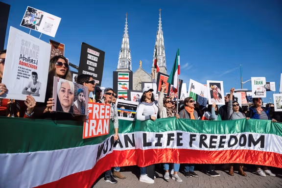 Protestors in support of women in Iran hold a banner reading 'Women Life Freedom' during a protest following the death of Mahsa Amini, in Ottawa, Ontario, Canada, October 29, 2022.