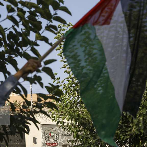 A gathering against Doha’s normalization of ties with Israel in front of the UAE embassy building in Tehran