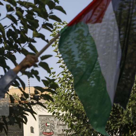 A gathering against Doha’s normalization of ties with Israel in front of the UAE embassy building in Tehran
