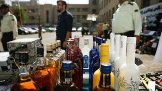 Who is behind the sale of lethal bootleg alcohol in Iran?