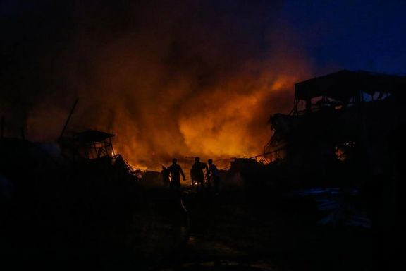 Firefighters working at the scene of a large fire in the Shadabad iron market in Tehran on October 12, 2024