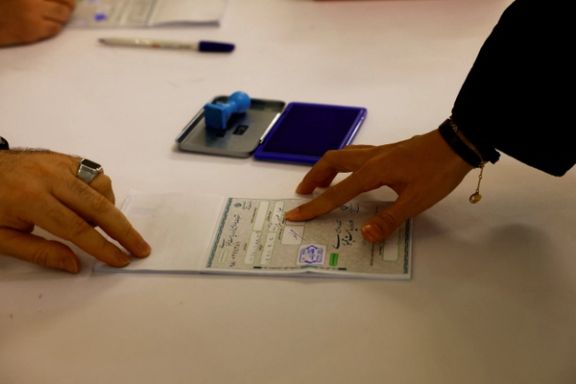 An Iranian voter participates in a snap presidential election to choose a successor to Ebrahim Raisi following his death in a helicopter crash, at the Iranian consulate in Dubai, United Arab Emirates, June 28, 2024.