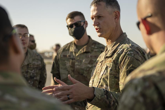 Air Force Lt. Gen. Alexus Grynkewich talks with airmen in September 2021 at an undisclosed location