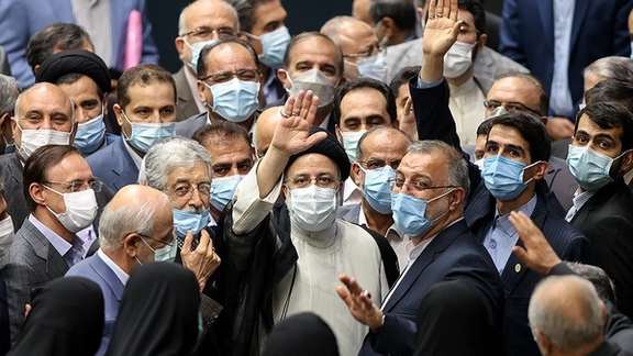 President Ebrahim Raisi surrounded by hardliners and conservatives during his inauguration in parliament in August 2021