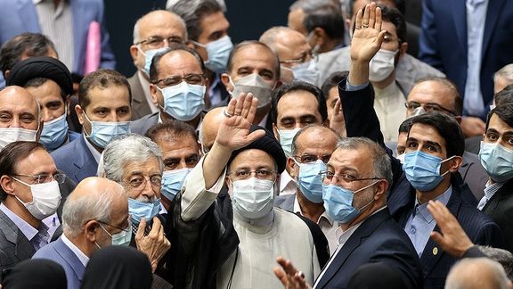 Hardliners dominating the parliament celebrate President Ebrahim Raisi's inauguration in August 2021