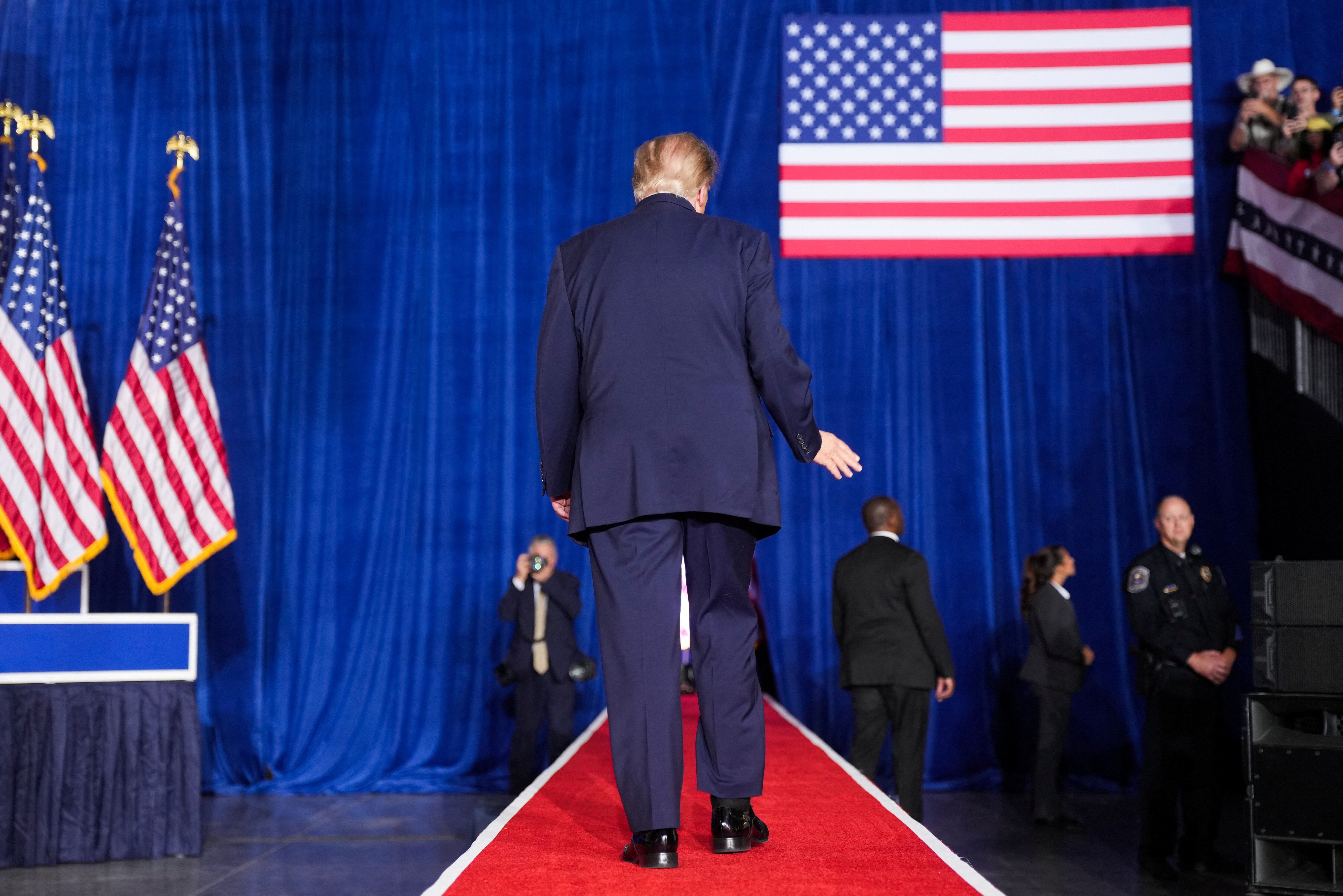 US President Donald Trump leaves the stage after a rally at Pinnacle Bank Expo Center in Grand Island, Nebraska, US, October 5, 2026.