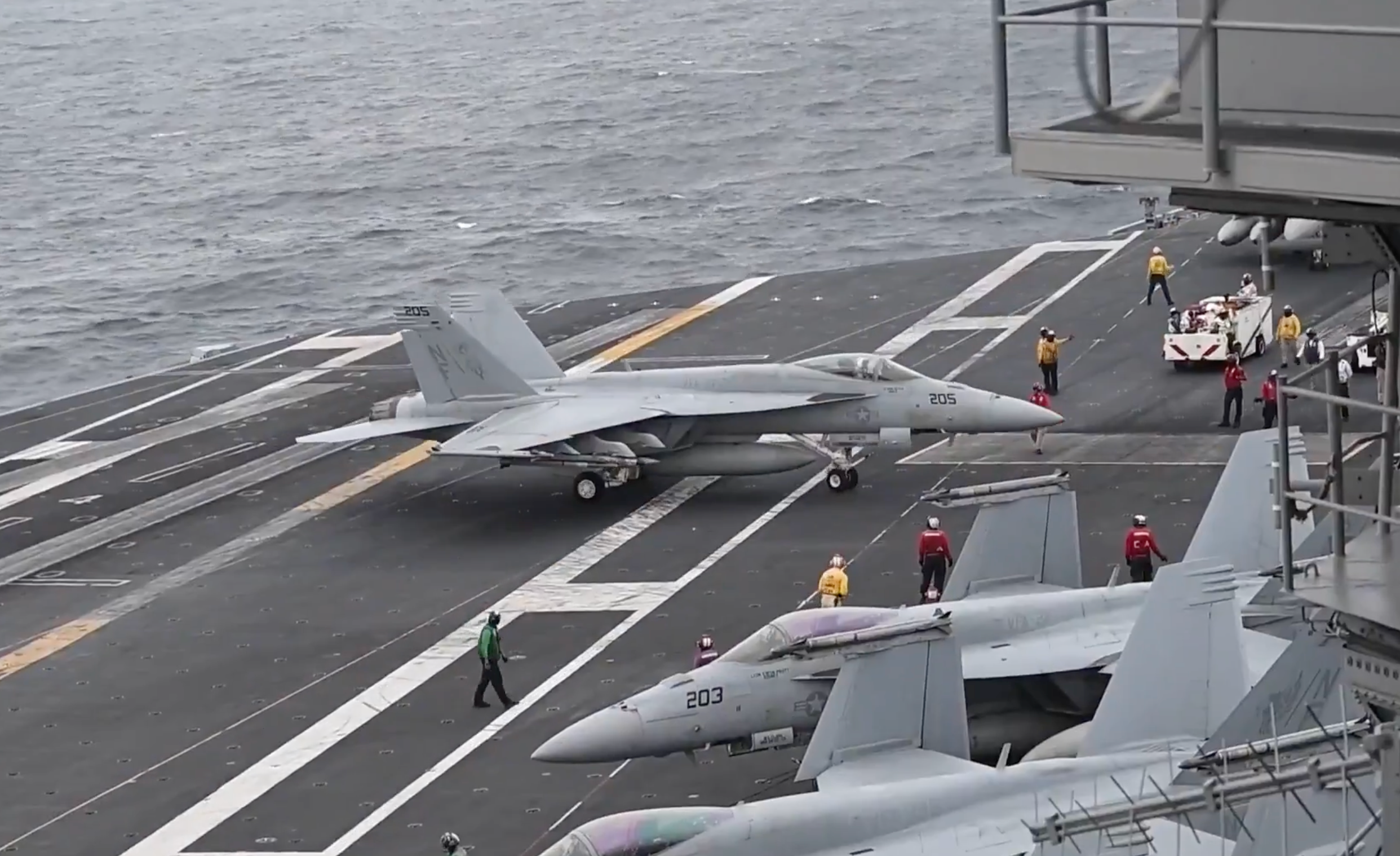 A screen-grab of a CENTCOM video shows USS George Washington conducting flight operations in the Middle East