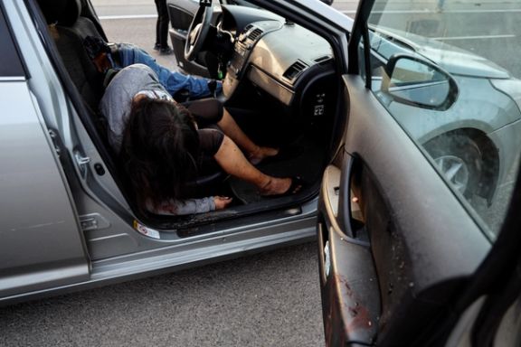 A man and woman lie dead in their car, in the Sderot area, southern Israel October 7, 2023.