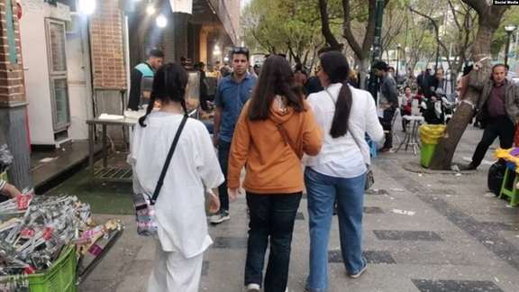 Iranian women defying mandatory hijab in public