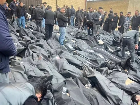 Families look for their loved ones in body bags piled outside a morgue in Iran, January 2026