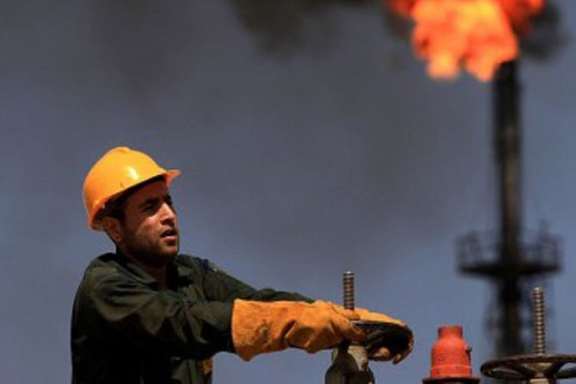 A worker at an oil facility in southern Iran