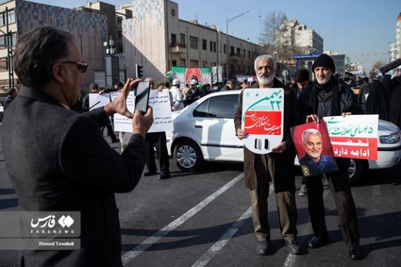 People taking photos during regime-sponsored demonstrations to mark the 45th anniversary of Islamic Republic establishment, Tehran, February 11, 2024