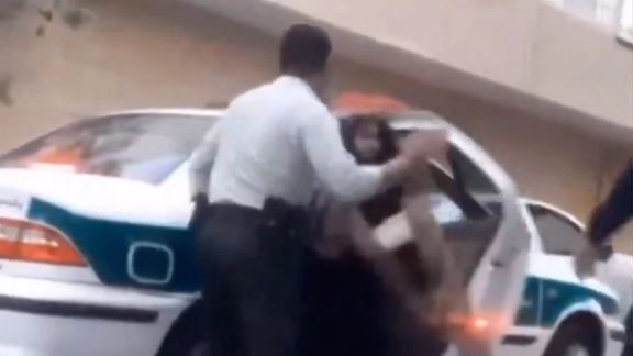 A screen grab of a video showing Iranian police forces violently arresting a woman over mandatory hijab (May 14, 2024)