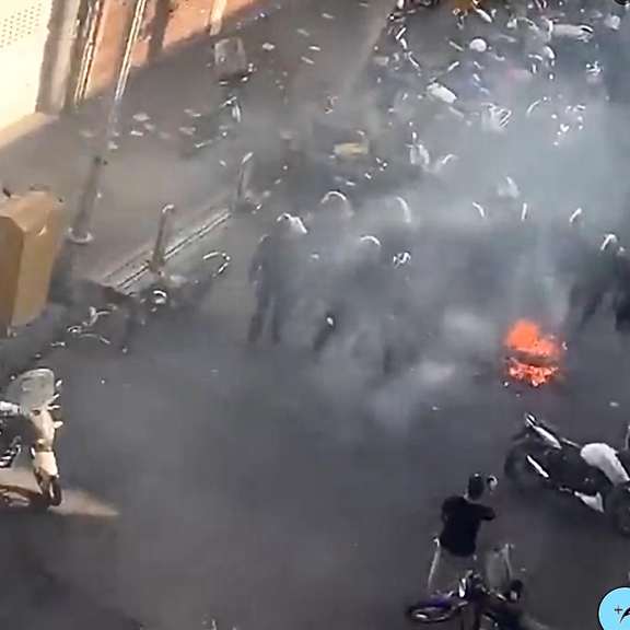 Special police units dispersing protesters in Tehran's Lalehzar street on October 12, 2022