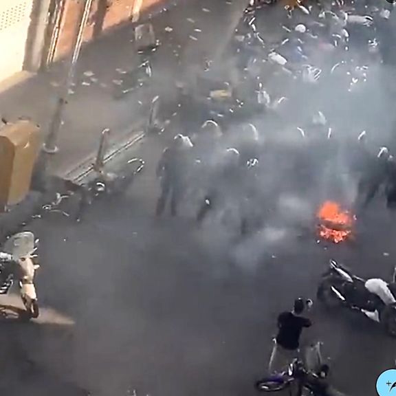 Special police units dispersing protesters in Tehran's Lalehzar street on October 12, 2022