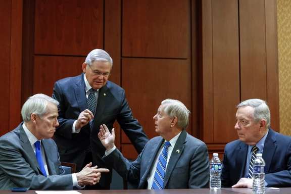 United States Senators Rob Portman (R-OH), Bob Menendez (D-NJ), Lindsey Graham (R-SC), and Dick Durbin (D-IL) at the United States Capitol in Washington on December 6, 2022