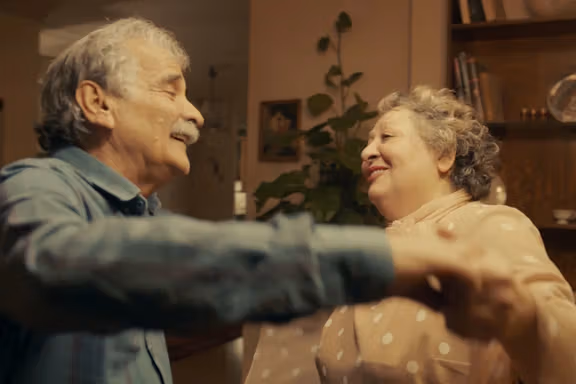 Esmaeil Mehrabi and Lily Farhadpour dancing together in a scene from the movie My Favorite Cake.